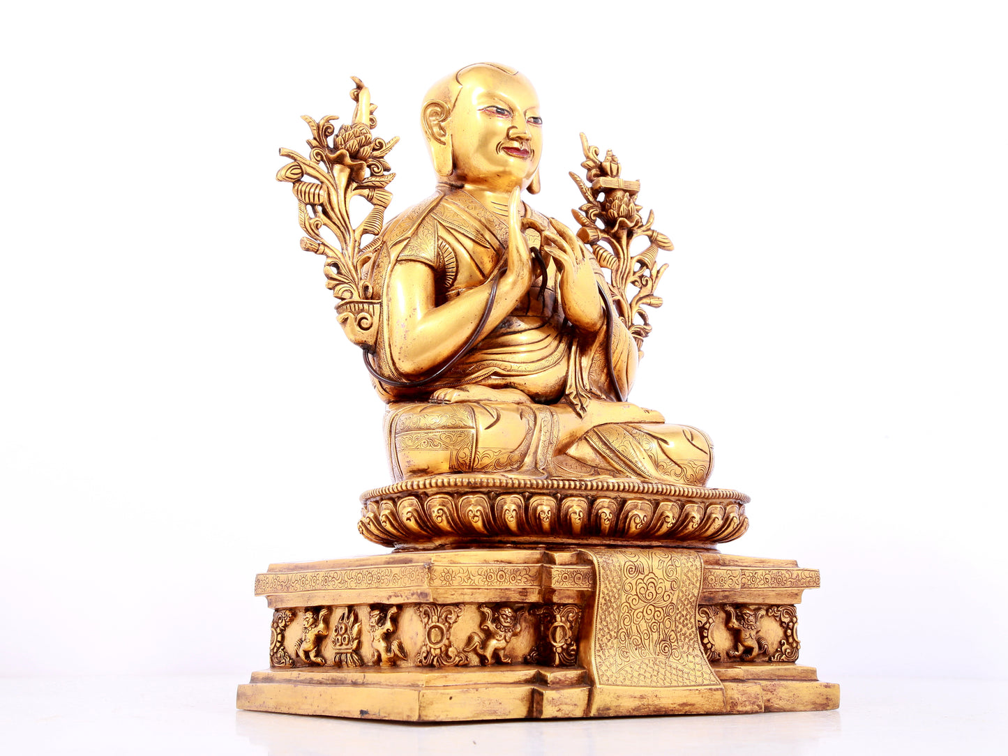 A solemn gilt bronze statue of guru