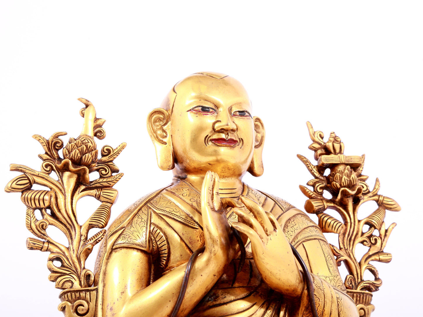 A solemn gilt bronze statue of guru