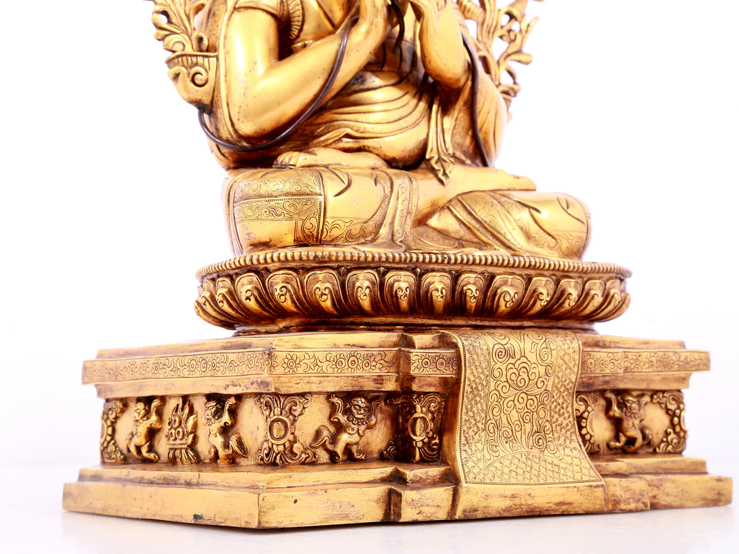 A solemn gilt bronze statue of guru