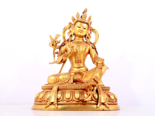 A solemn gilt bronze statue of green Tara