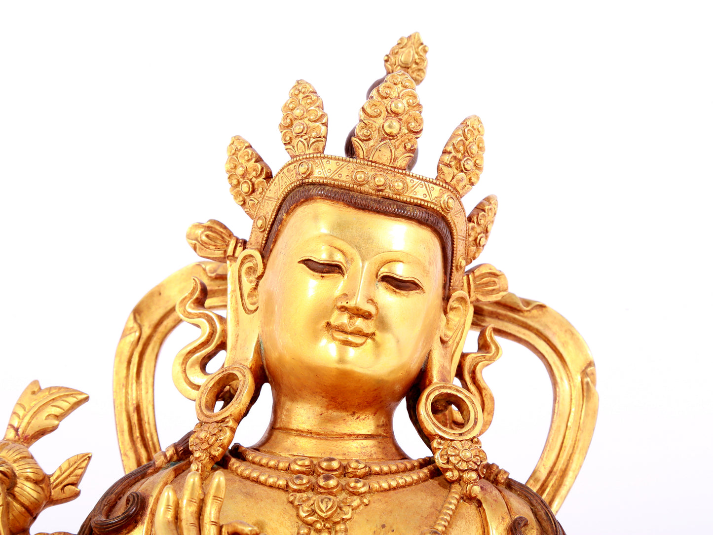 A solemn gilt bronze statue of green Tara