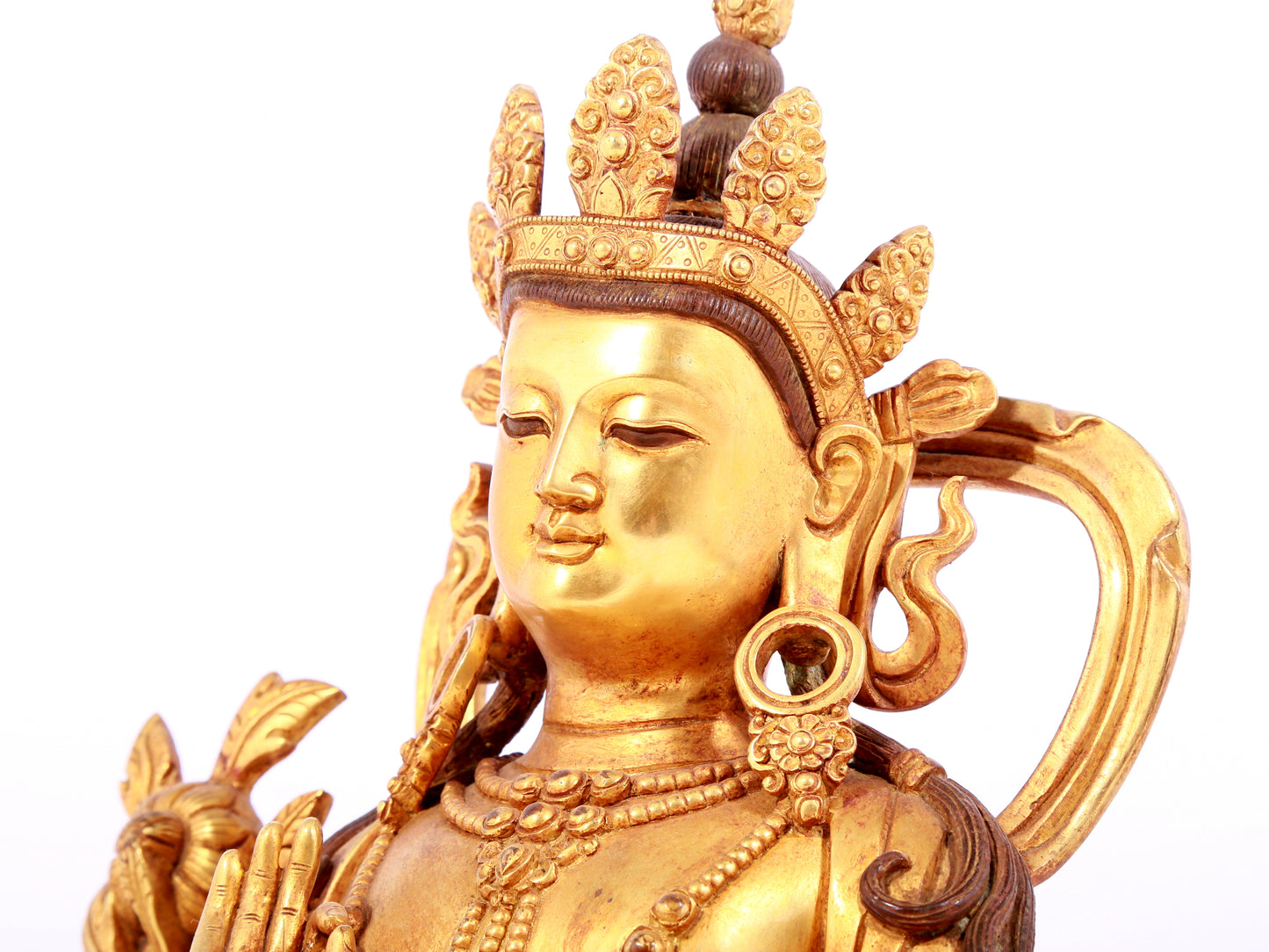 A solemn gilt bronze statue of green Tara