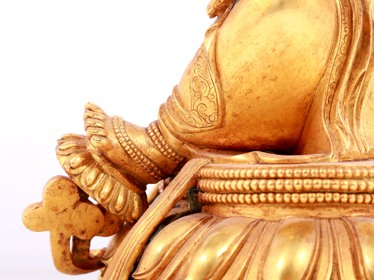 A solemn gilt bronze statue of green Tara