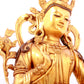 A solemn gilt bronze statue of green Tara