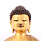 A solemn gilt bronze statue of Sakyamuni