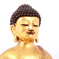 A solemn gilt bronze statue of Sakyamuni