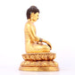 A solemn gilt bronze statue of Sakyamuni