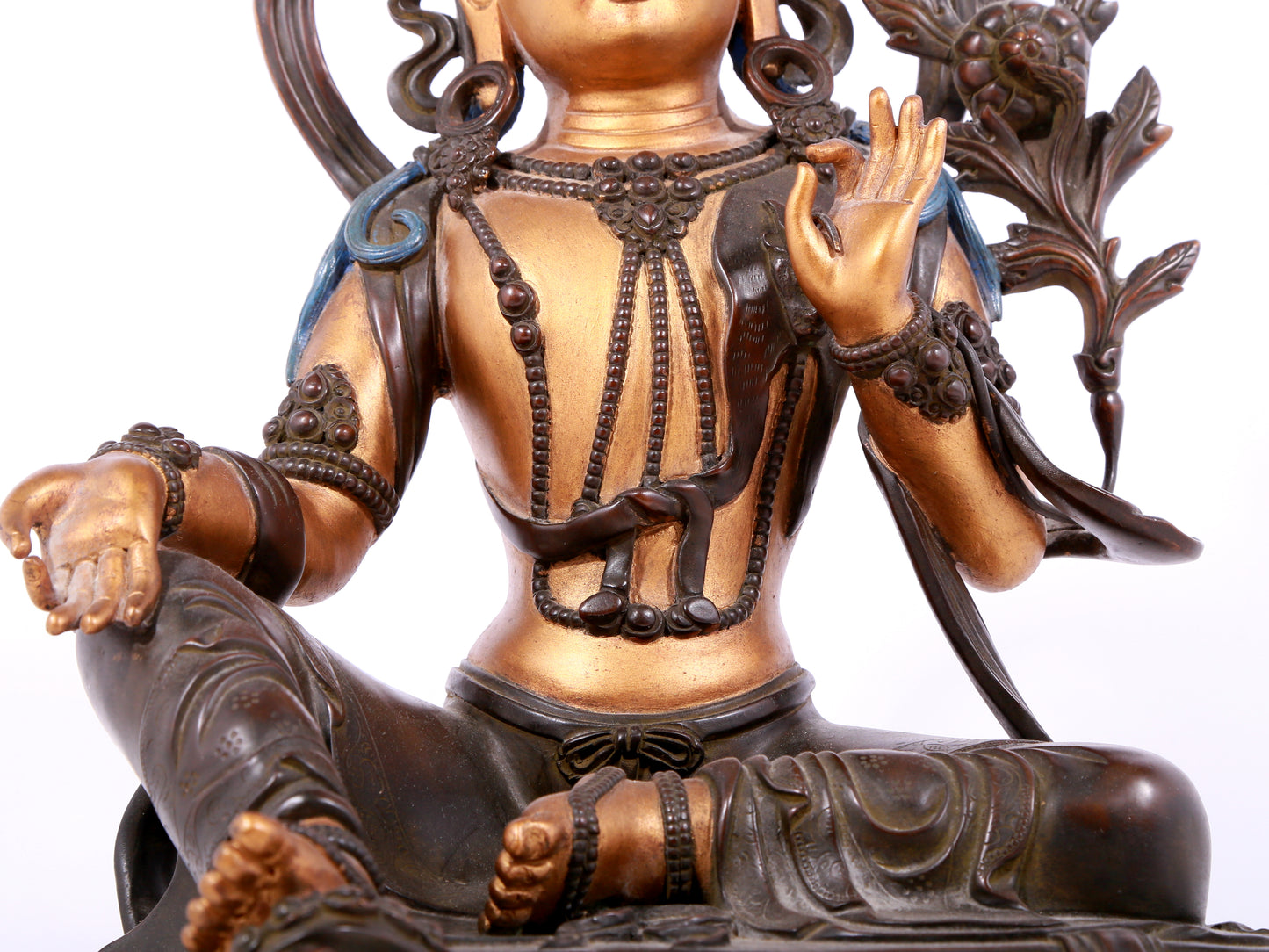 A solemn gilt bronze statue of green Tara