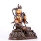 A solemn gilt bronze statue of green Tara