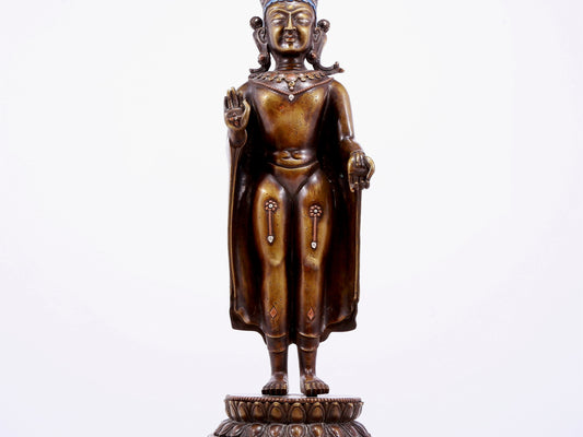 An alloy copper inlaid silver Buddha statue