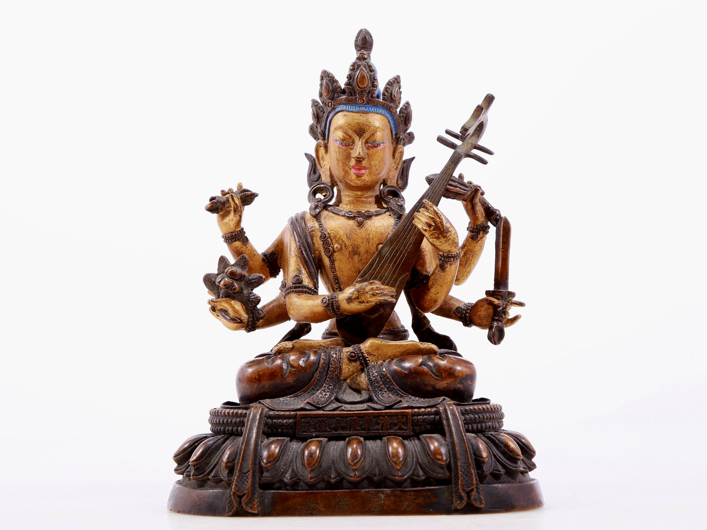 A gilt bronze statue of Saraswati