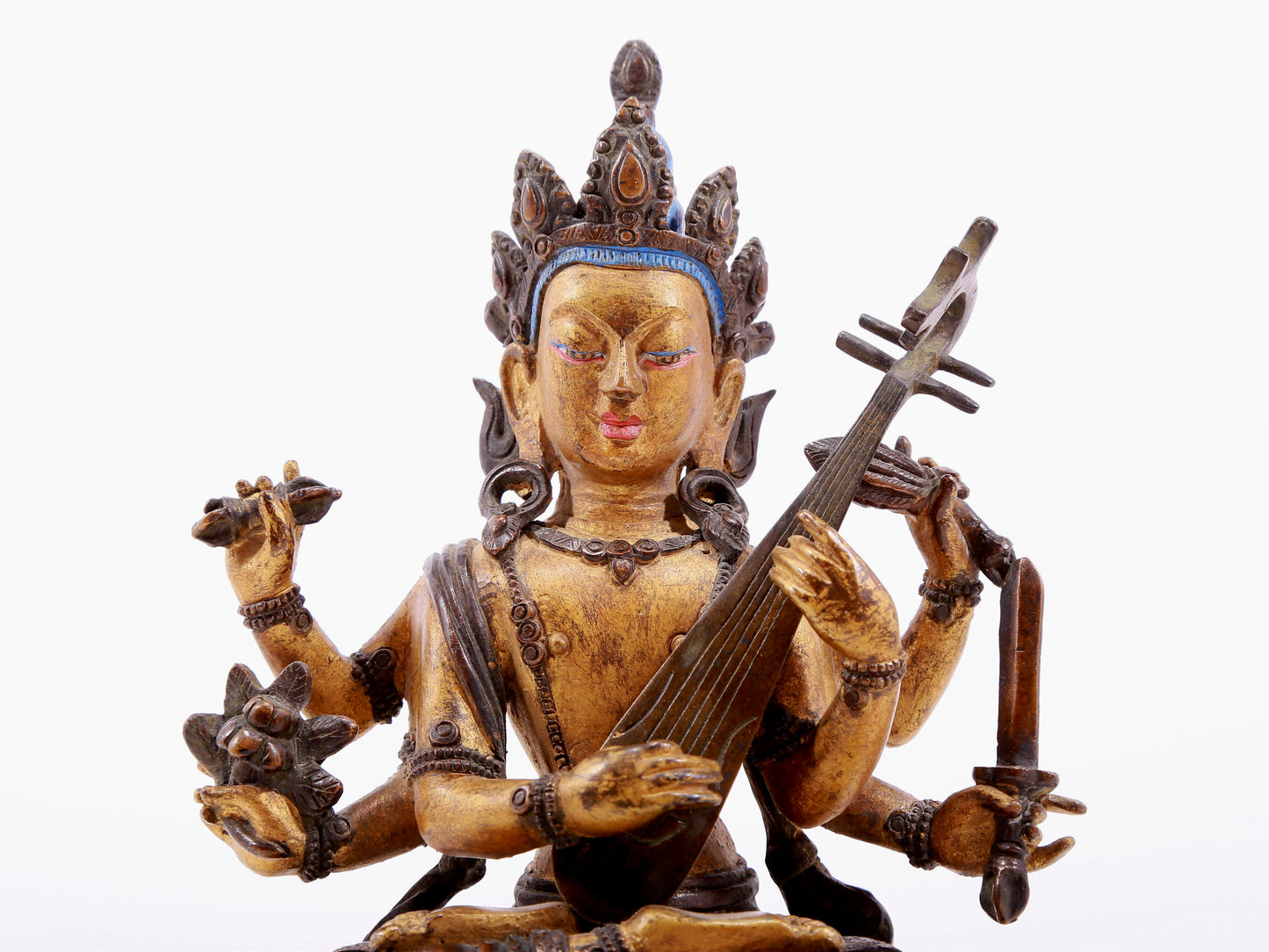 A gilt bronze statue of Saraswati