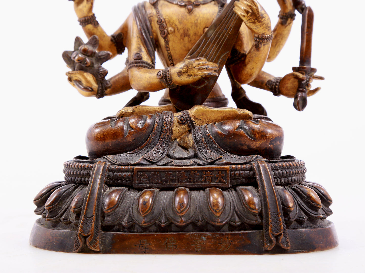 A gilt bronze statue of Saraswati