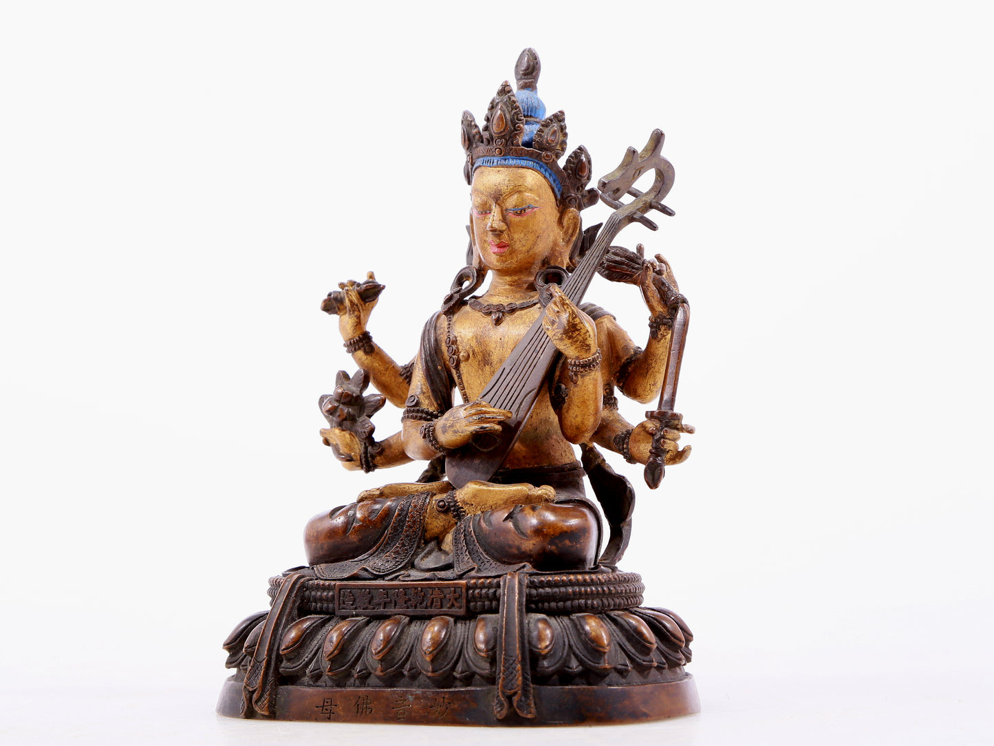 A gilt bronze statue of Saraswati