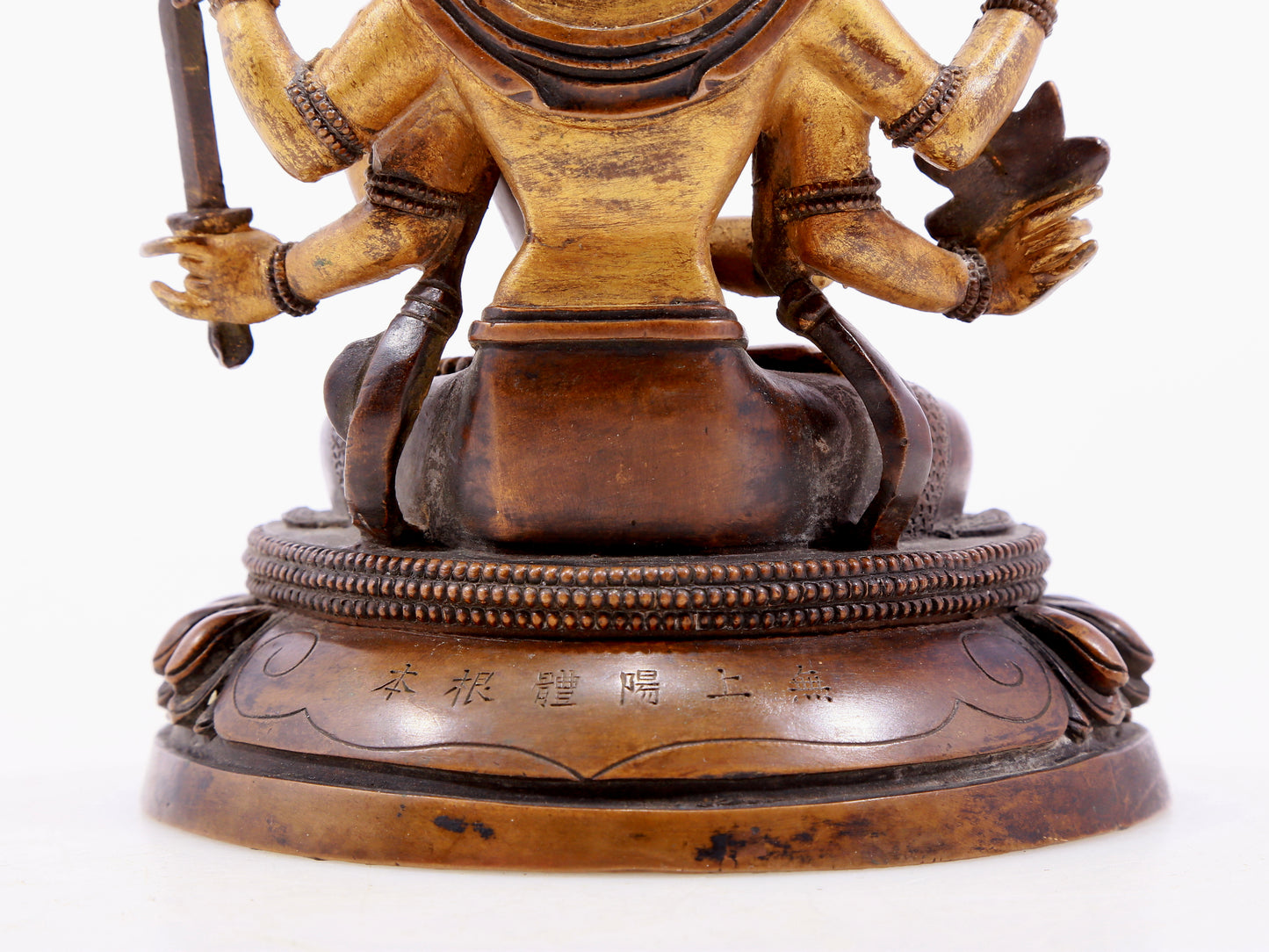 A gilt bronze statue of Saraswati