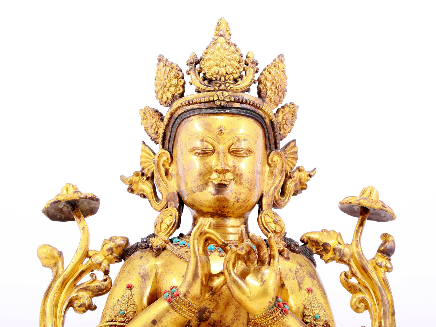 A gilt bronze statue of Tara inlaid with hundreds of treasures