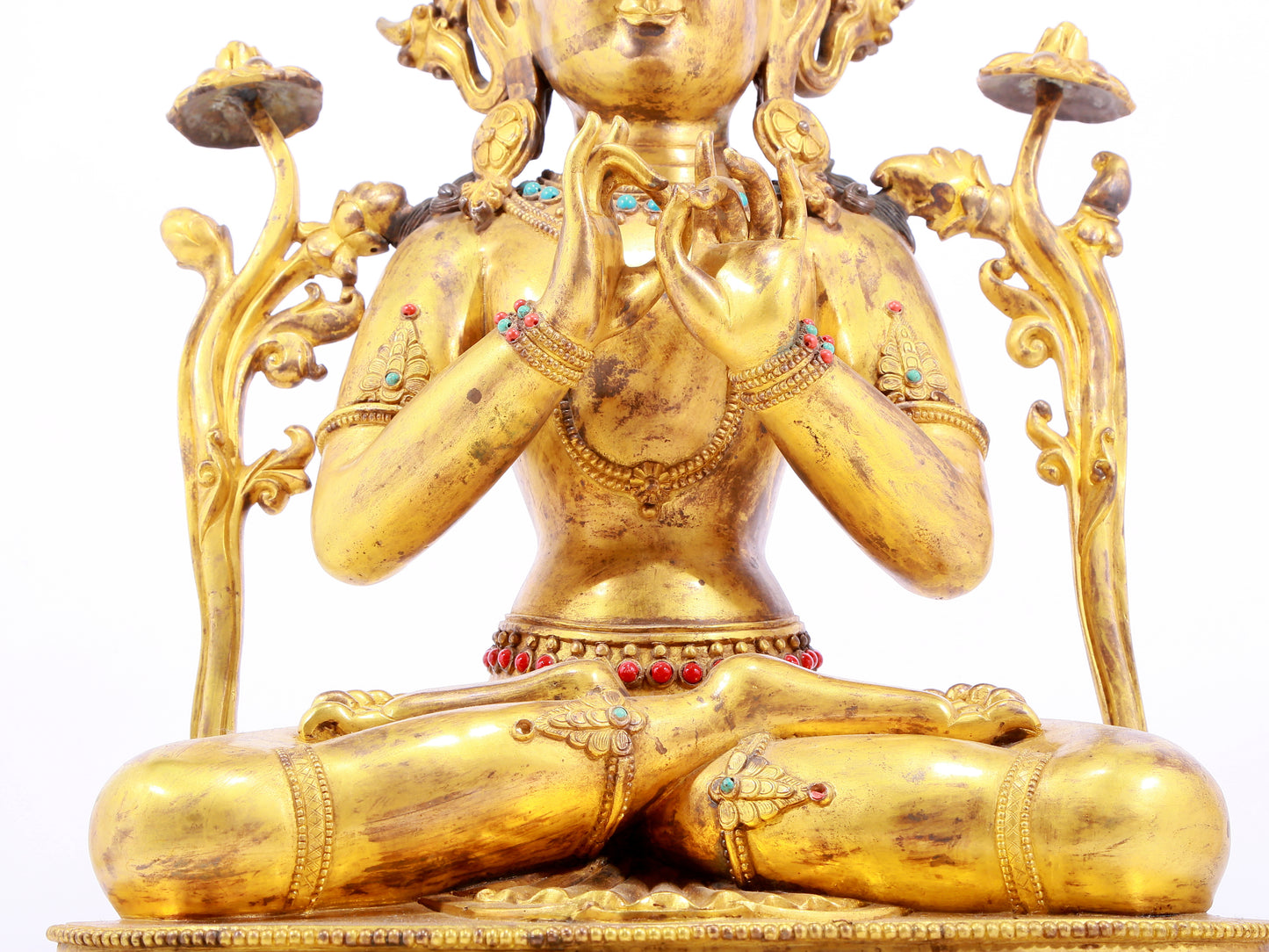 A gilt bronze statue of Tara inlaid with hundreds of treasures