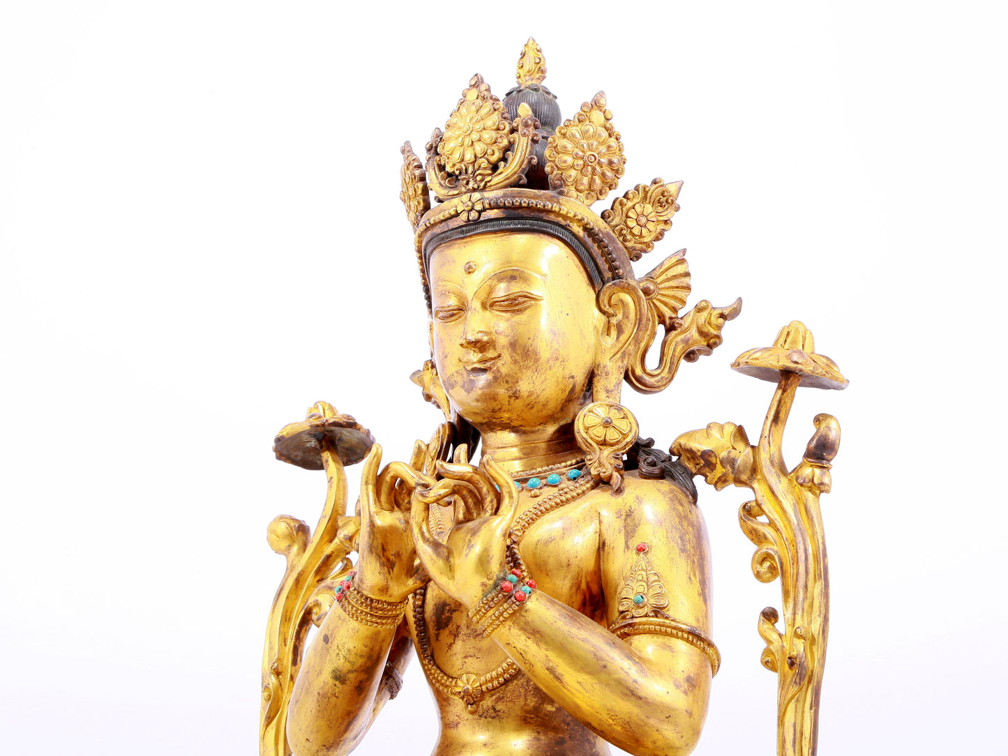 A gilt bronze statue of Tara inlaid with hundreds of treasures