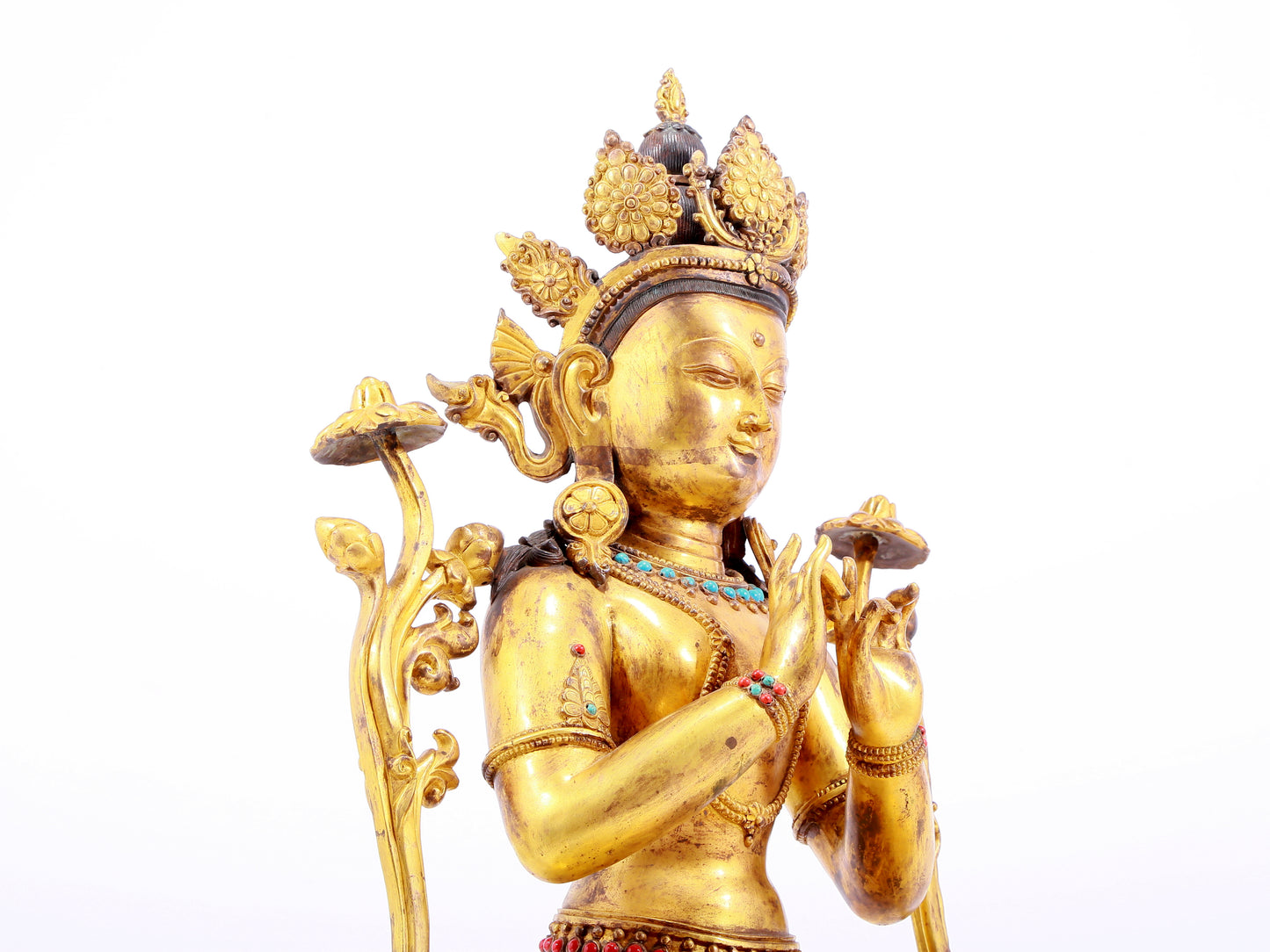 A gilt bronze statue of Tara inlaid with hundreds of treasures