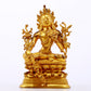 A serene gilt bronze green Tara statue