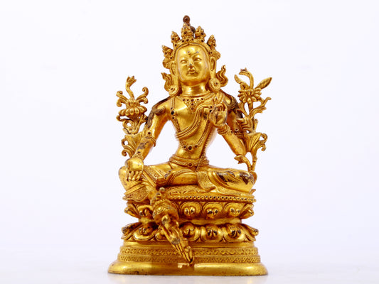 A serene gilt bronze green Tara statue