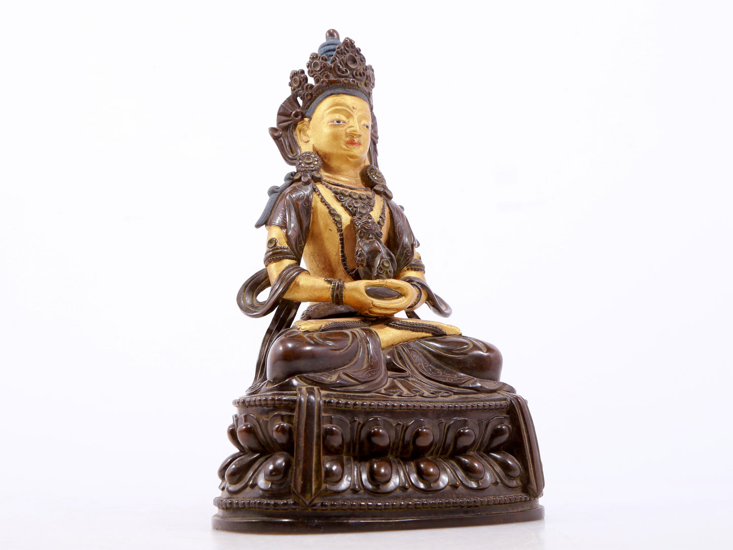 A serene gilt bronze statue of Amitayus Buddha