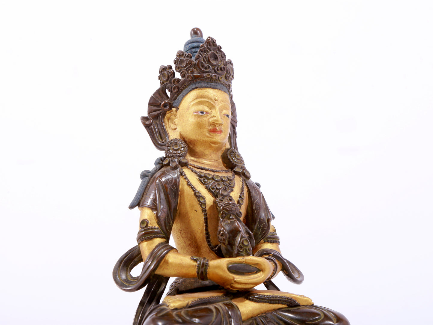 A serene gilt bronze statue of Amitayus Buddha