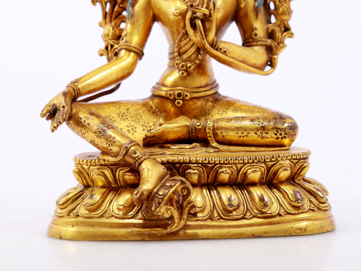 A serene gilt bronze green Tara statue