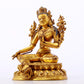 A serene gilt bronze green Tara statue