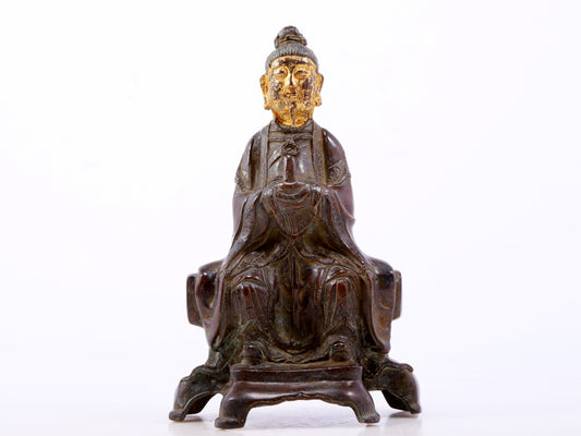 A serene gilt bronze figure