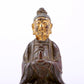 A serene gilt bronze figure