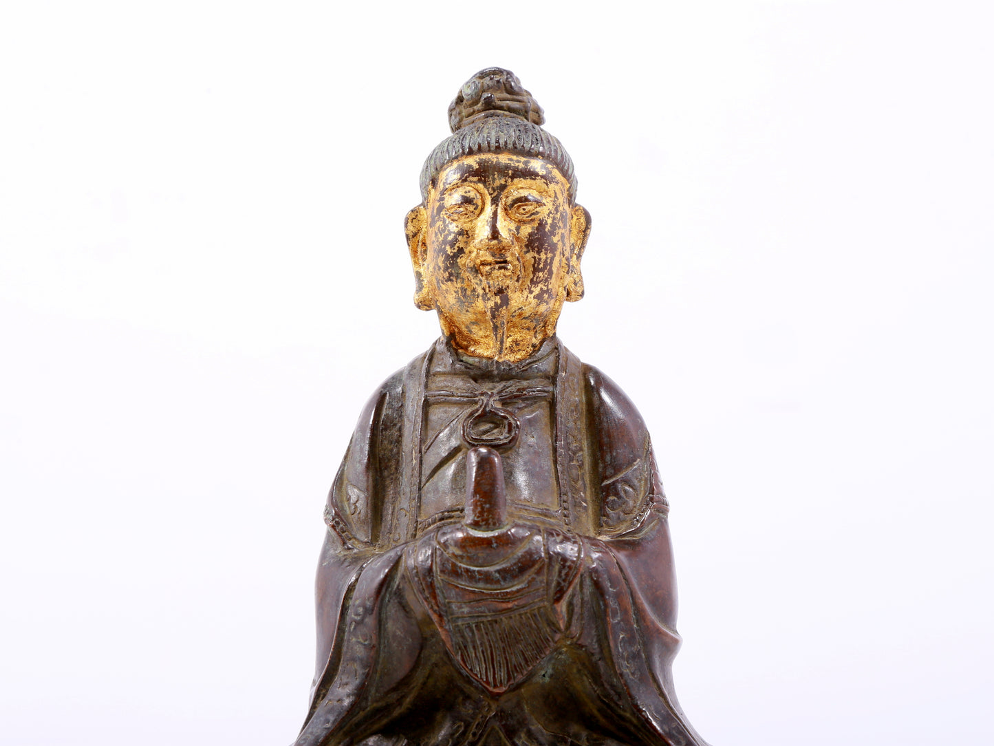 A serene gilt bronze figure