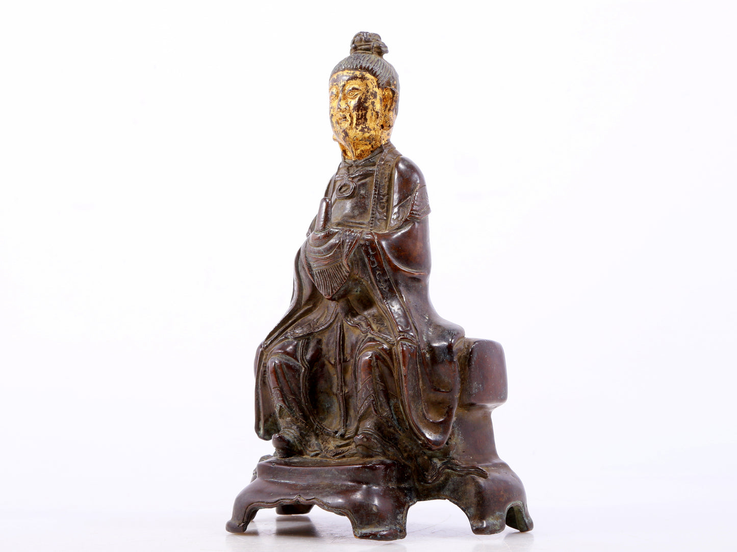 A serene gilt bronze figure