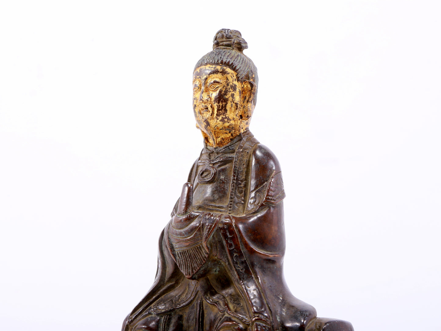 A serene gilt bronze figure