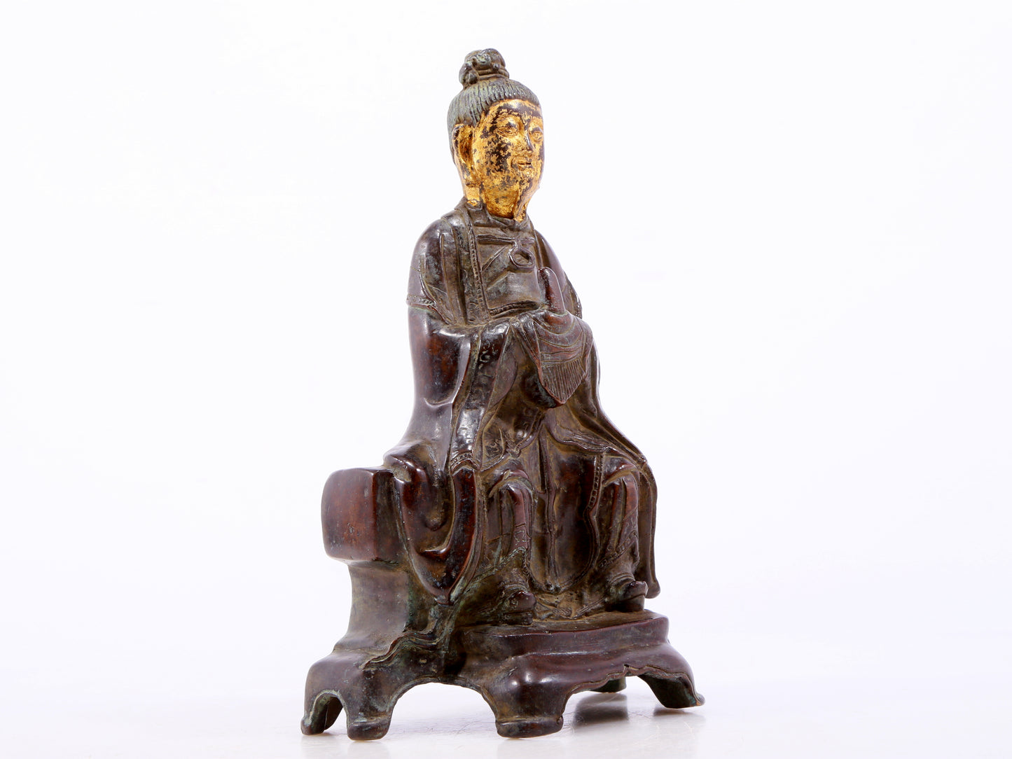 A serene gilt bronze figure