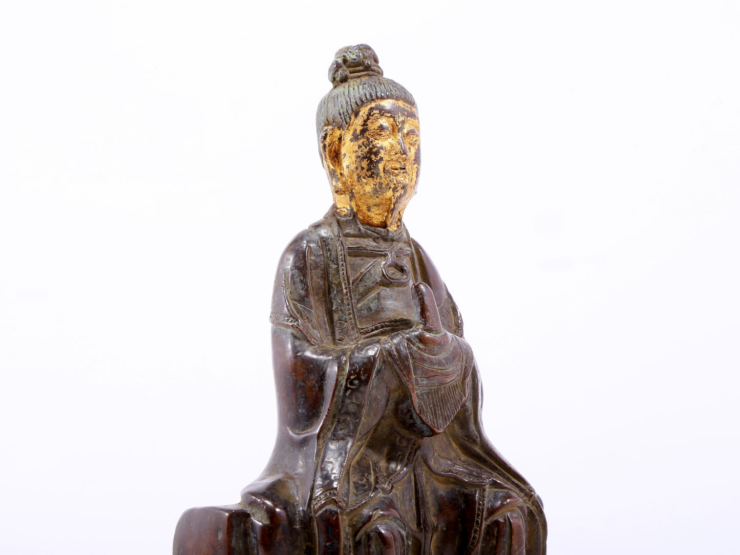 A serene gilt bronze figure