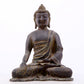 A serene gilt bronze statue of Gautama Buddha