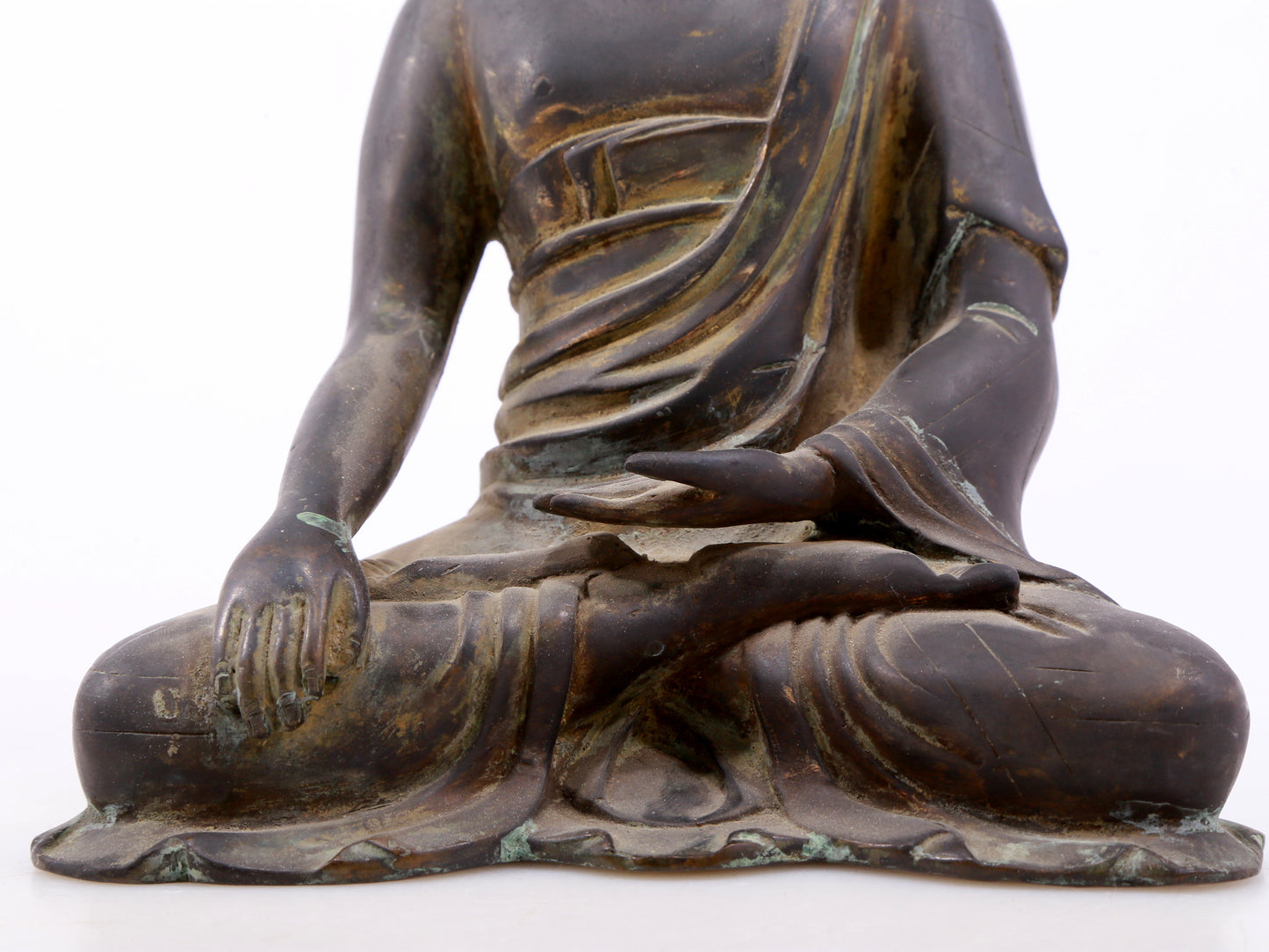 A serene gilt bronze statue of Gautama Buddha