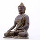 A serene gilt bronze statue of Gautama Buddha