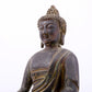 A serene gilt bronze statue of Gautama Buddha