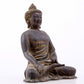 A serene gilt bronze statue of Gautama Buddha