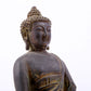 A serene gilt bronze statue of Gautama Buddha