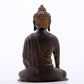 A serene gilt bronze statue of Gautama Buddha