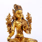 A serene gilt bronze green Tara statue