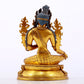 A serene gilt bronze green Tara statue