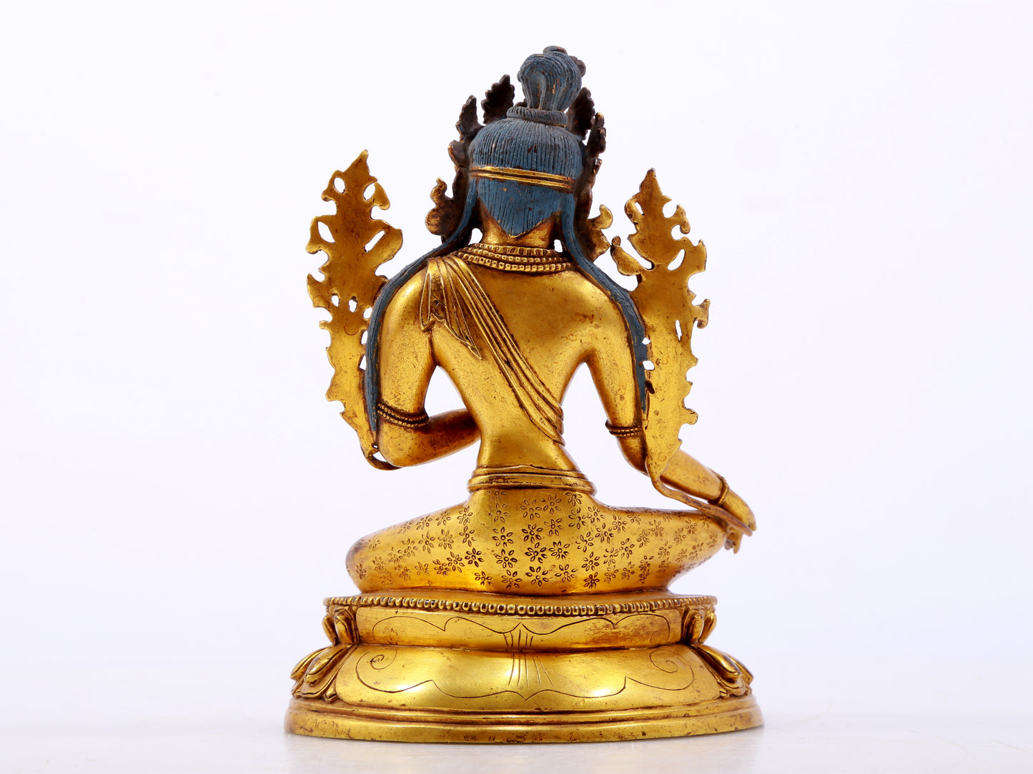 A serene gilt bronze green Tara statue