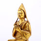 A serene gilt bronze statue of Tsongkhapa