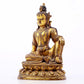 A serene gilt bronze statue of Guanyin