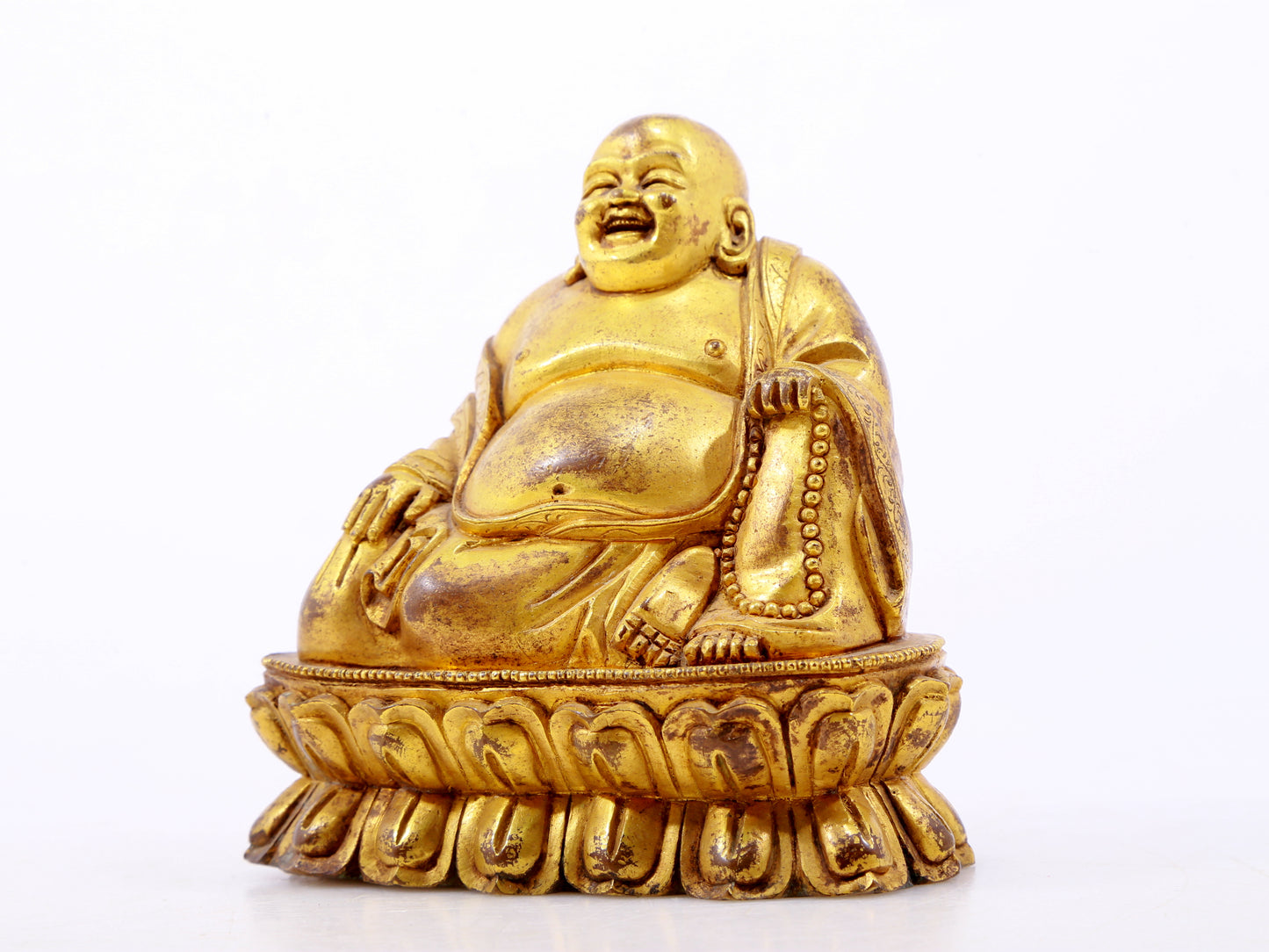 A serene gilt bronze Maitreya statue