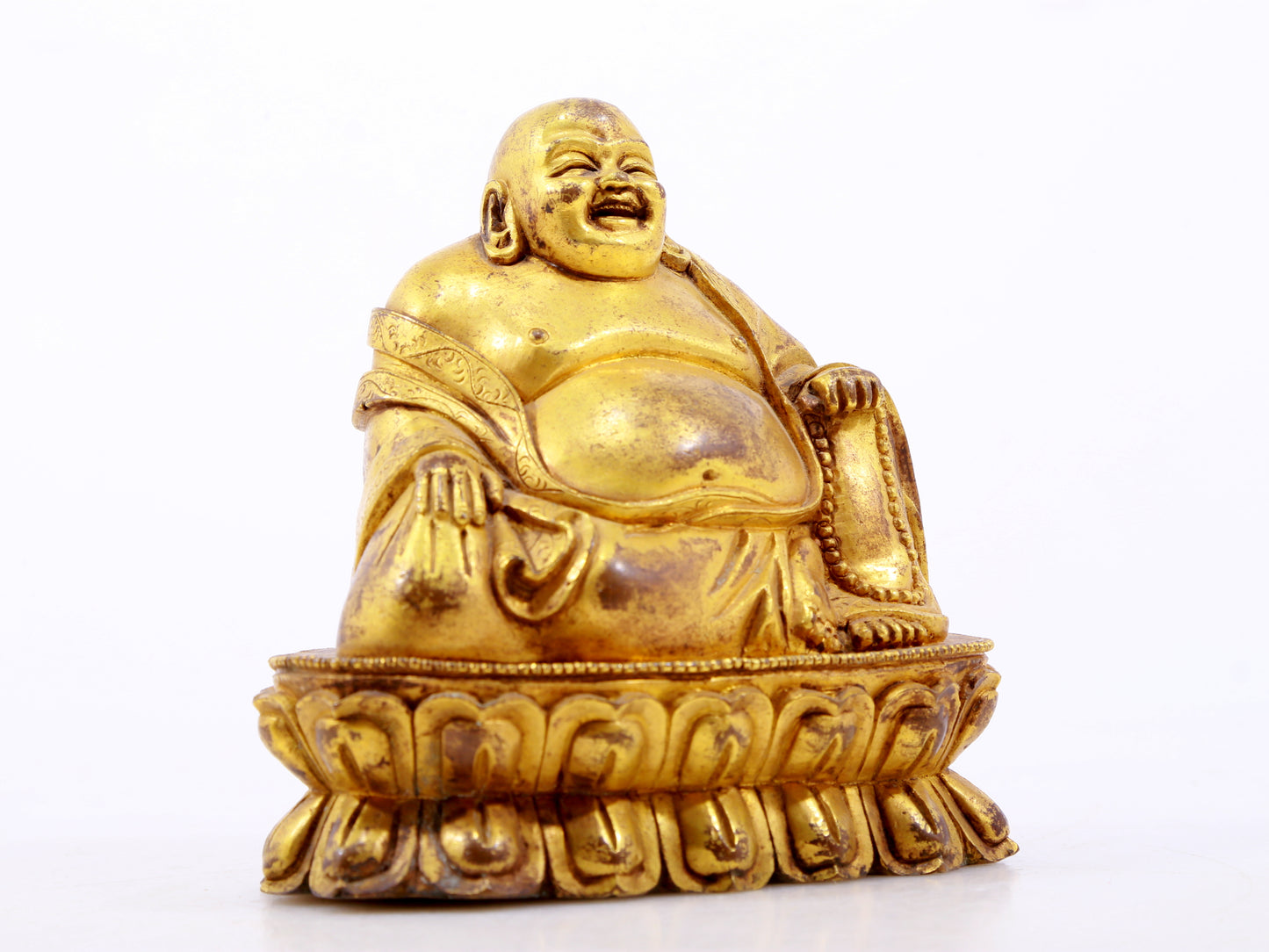 A serene gilt bronze Maitreya statue